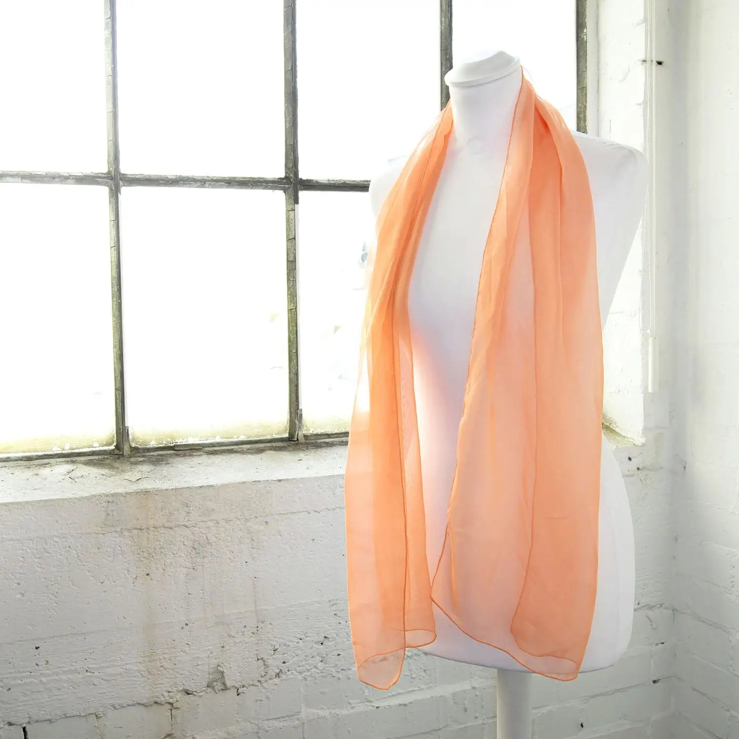 Luxurious Lightweight Chiffon Scarf: Classic Plain Design mannequin with scarf in front of window