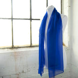 Classic plain chiffon scarf hanging on white mannequin