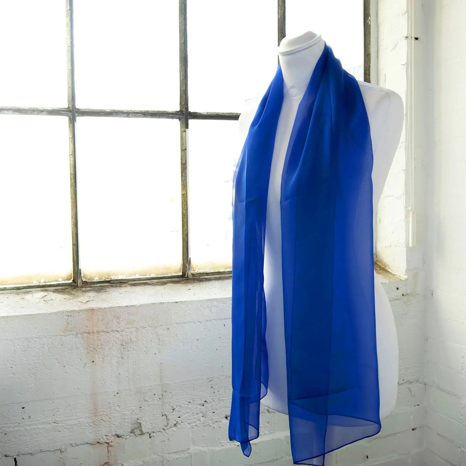 Blue chiffon scarf hanging on white mannequin: Classic plain design Luxurious Lightweight Chiffon Scarf