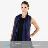 Luxurious two tone chiffon scarf on woman wearing black top and blue scarf in product display.