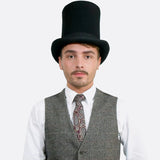 Men’s Classic Tall Top Hat for Special Occasions: Stylish man in top hat and vest