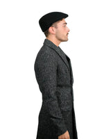 Man in black hat and coat wearing Men’s Traditional Paperboy Flat Cap