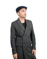 Man wearing Men’s Traditional Paperboy Flat Cap in black and white coat and hat.