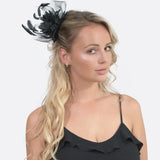 Woman wearing black and white mesh flower & feather fascinator hair accessory comb