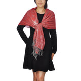Metallic Aztec print scarf on a woman in red