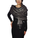 Metallic floral print scarf on woman in black dress