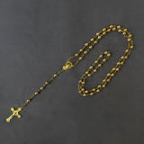 Metallic rosary beads necklace with saints pendant and cross icon.