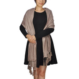 Woman wearing a brown metallic shimmer tassel shawl