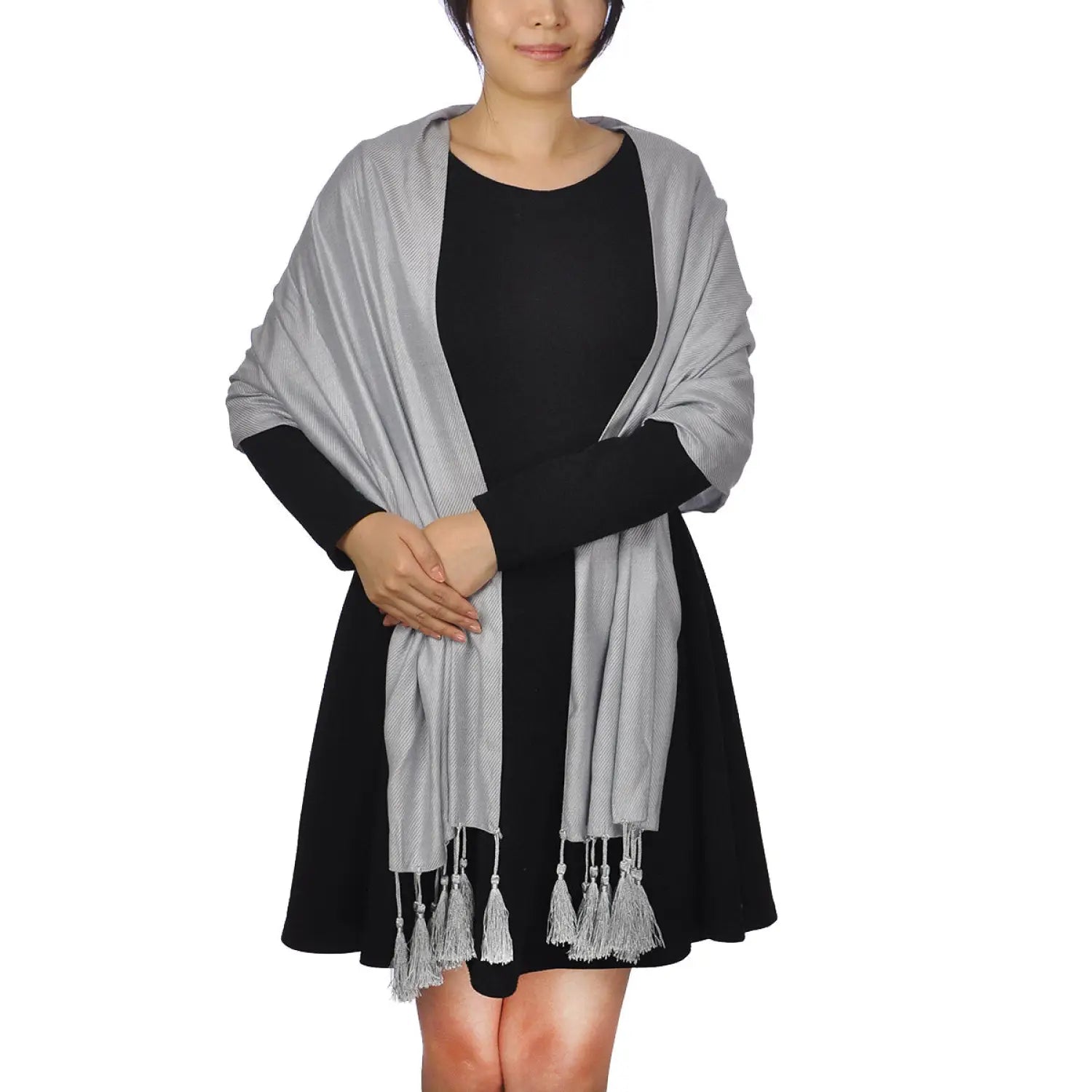 Woman wearing metallic shimmer tassel scarf