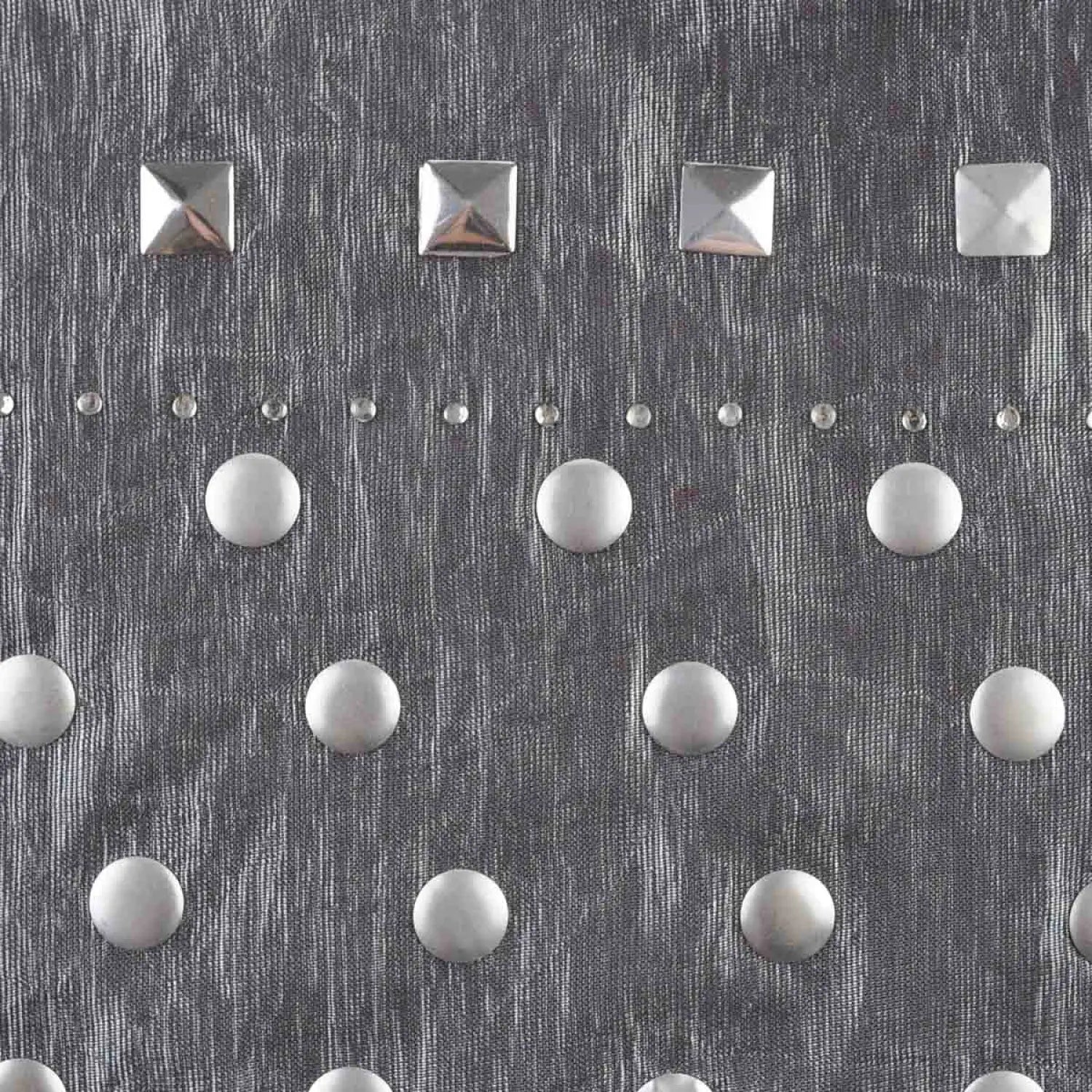 Metallic studded shimmering lightweight scarf on patterned wall