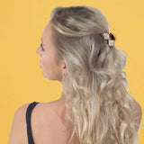 Blonde woman with a red flower in her hair, wearing Mini Diamante Crystal Double Diamond Hair Claw 2pcs