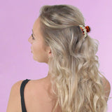 Blonde woman with flower in hair wearing Crystal Tiara Single Line Hair Claw