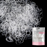 Mini rubber bands for hair in white color next to hair bag