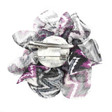 White and purple flower hair clip with zig zag patterned background