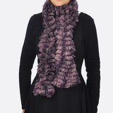 Woman wearing purple multicoloured textured boa print scarf with ru ru ruting.