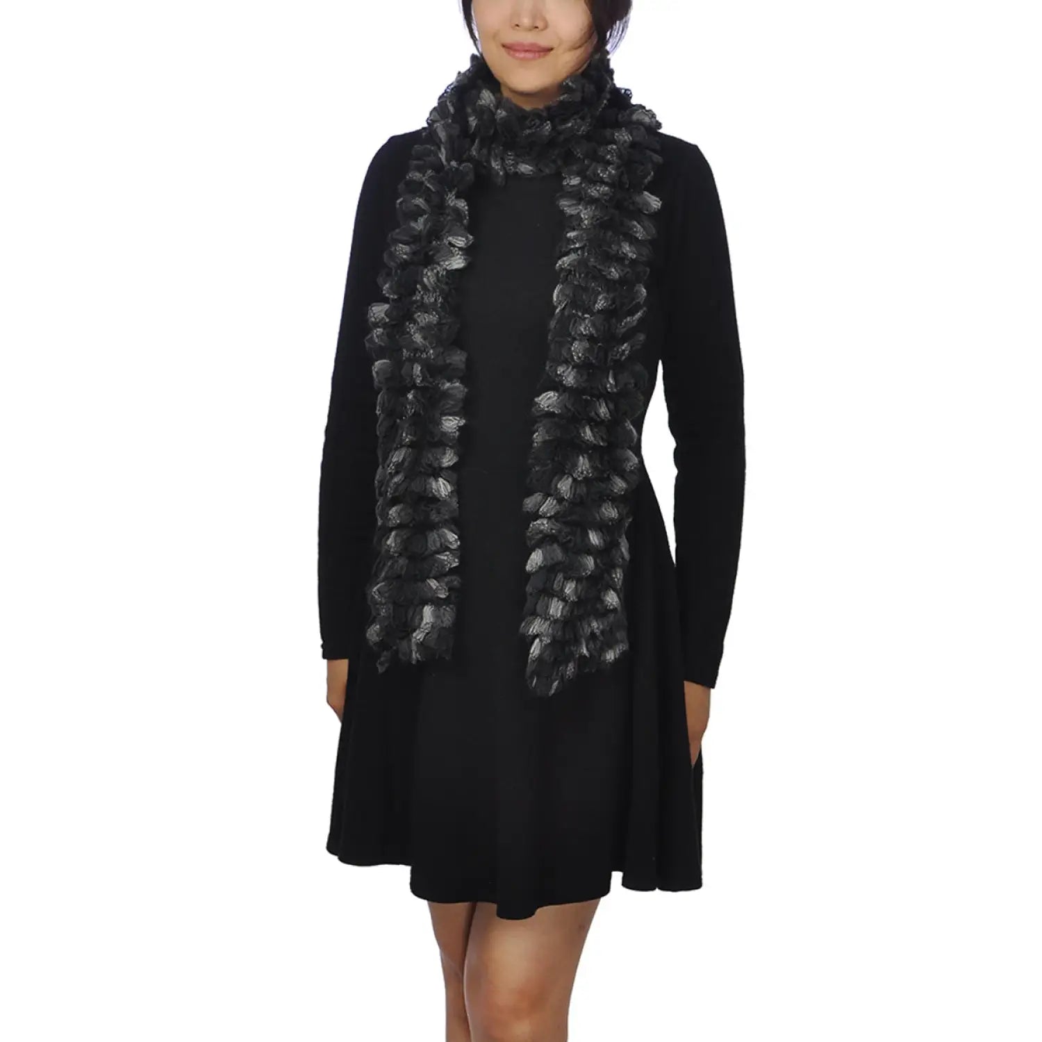 Woman in black dress and scarf with multicoloured textured boa print.