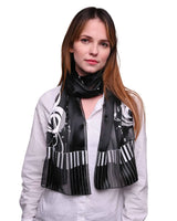 Satin stripe scarf with piano clef note design worn by woman
