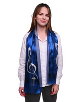 Woman wearing blue satin stripe scarf with white and black piano clef design.
