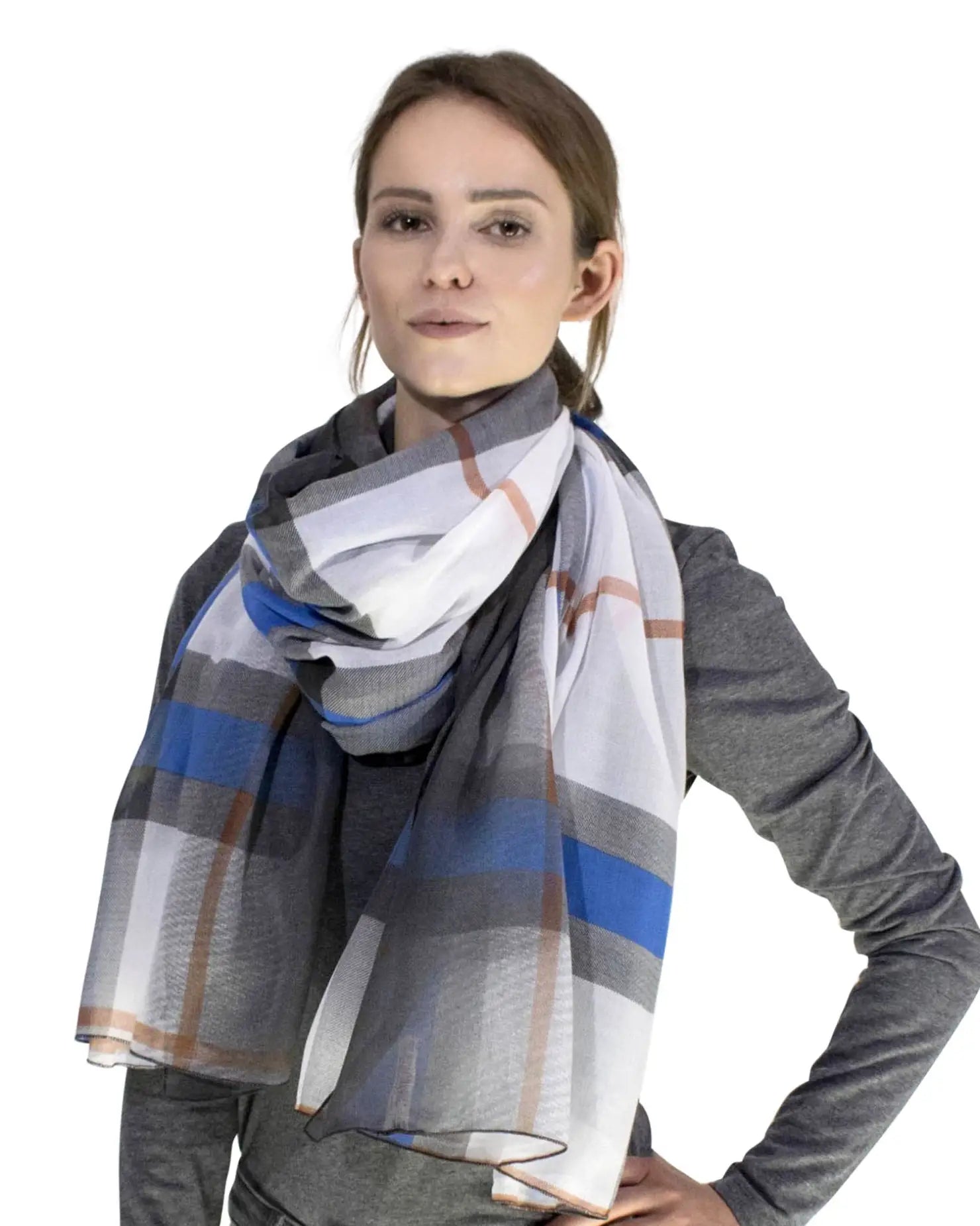 a woman wearing a scarf with a blue and white plaid pattern