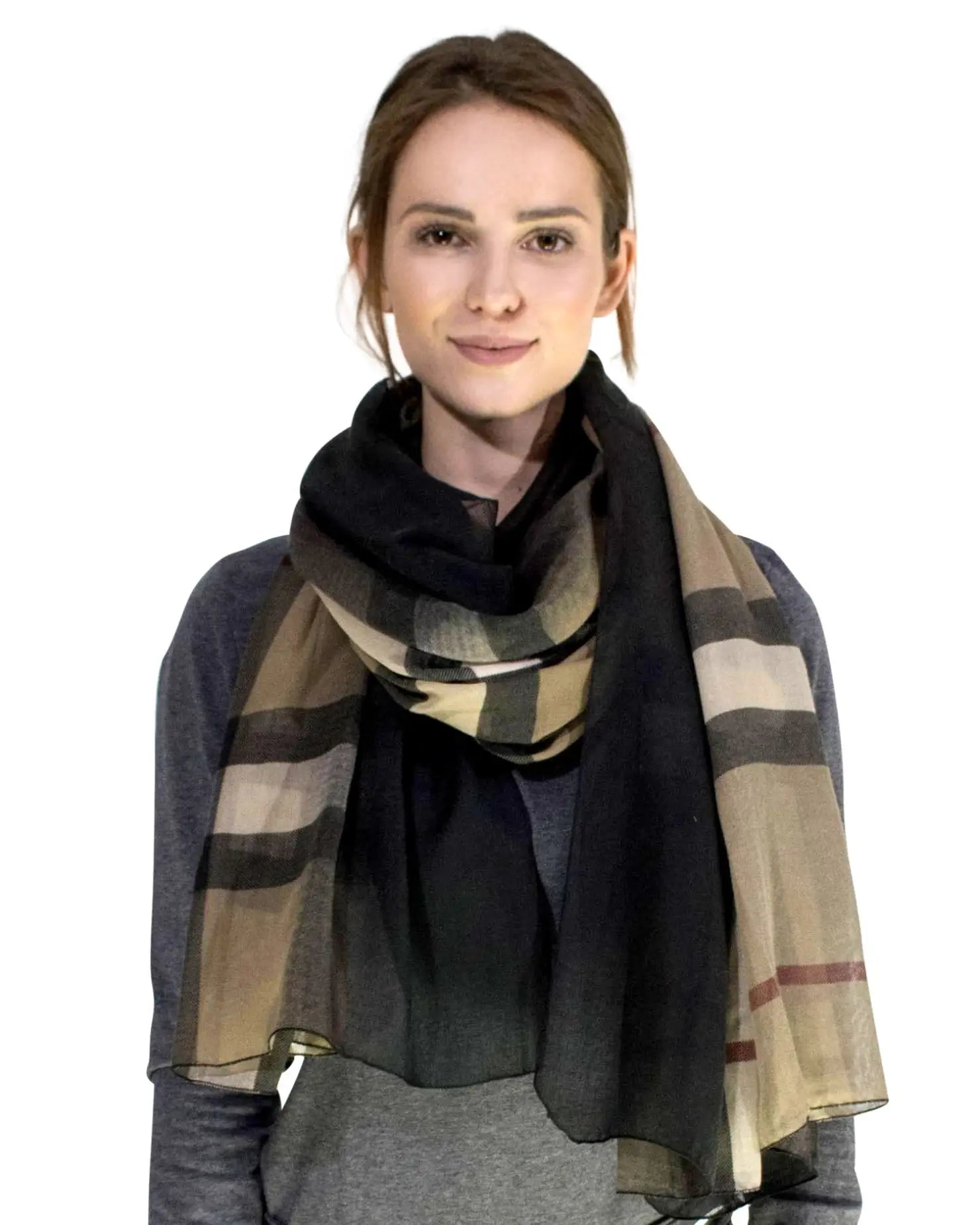 a woman wearing a scarf with a plaid pattern