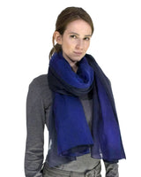 Woman wearing ombre tie dye blue scarf