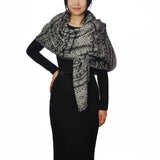 Oversized Aztec pattern shawl scarf worn by woman