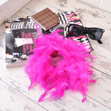 Oversized feather hair scrunchie with pink feather wreath and chocolate bar background