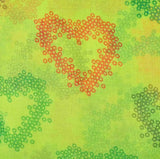 Green background with heart made of circles, oversized lightweight scarf with neon colours and heart print.