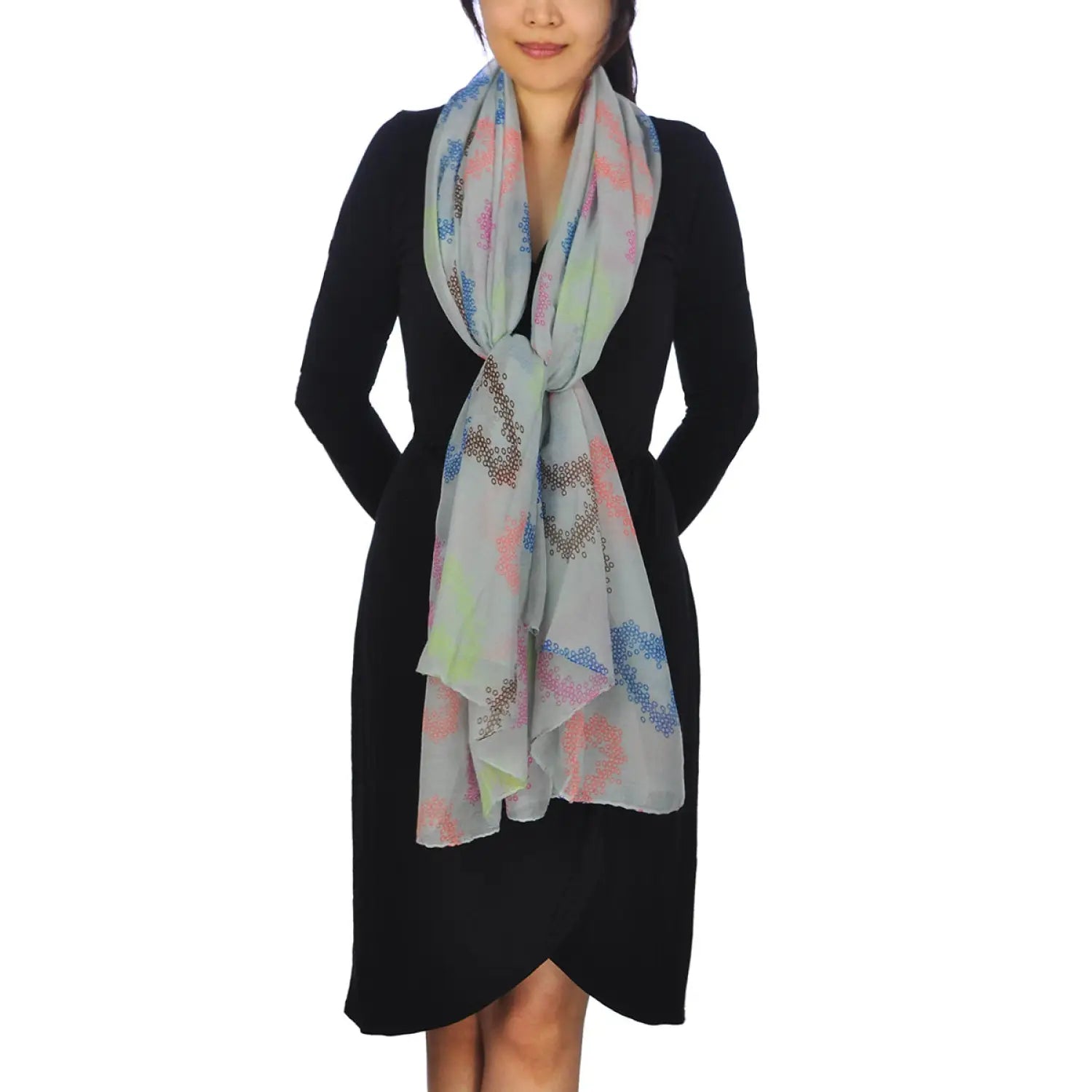 Woman wearing grey scarf with multi floral print from Oversized Lightweight Scarf with Heart Print & Neon Colours.
