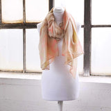 Oversized Lightweight Scarf with Heart Print & Neon Colours on mannequin by window