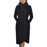 Woman in black dress with hoodie wearing Oversized Netted Lurex Knitted Scarf - Textured & Ruffled with Tassels.