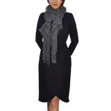 Knitted scarf with lurex detailing worn by woman