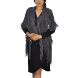 Woman wearing black shawl with fringes - Oversized Netted Lurex Knitted Scarf - Textured & Ruffled with Tassels
