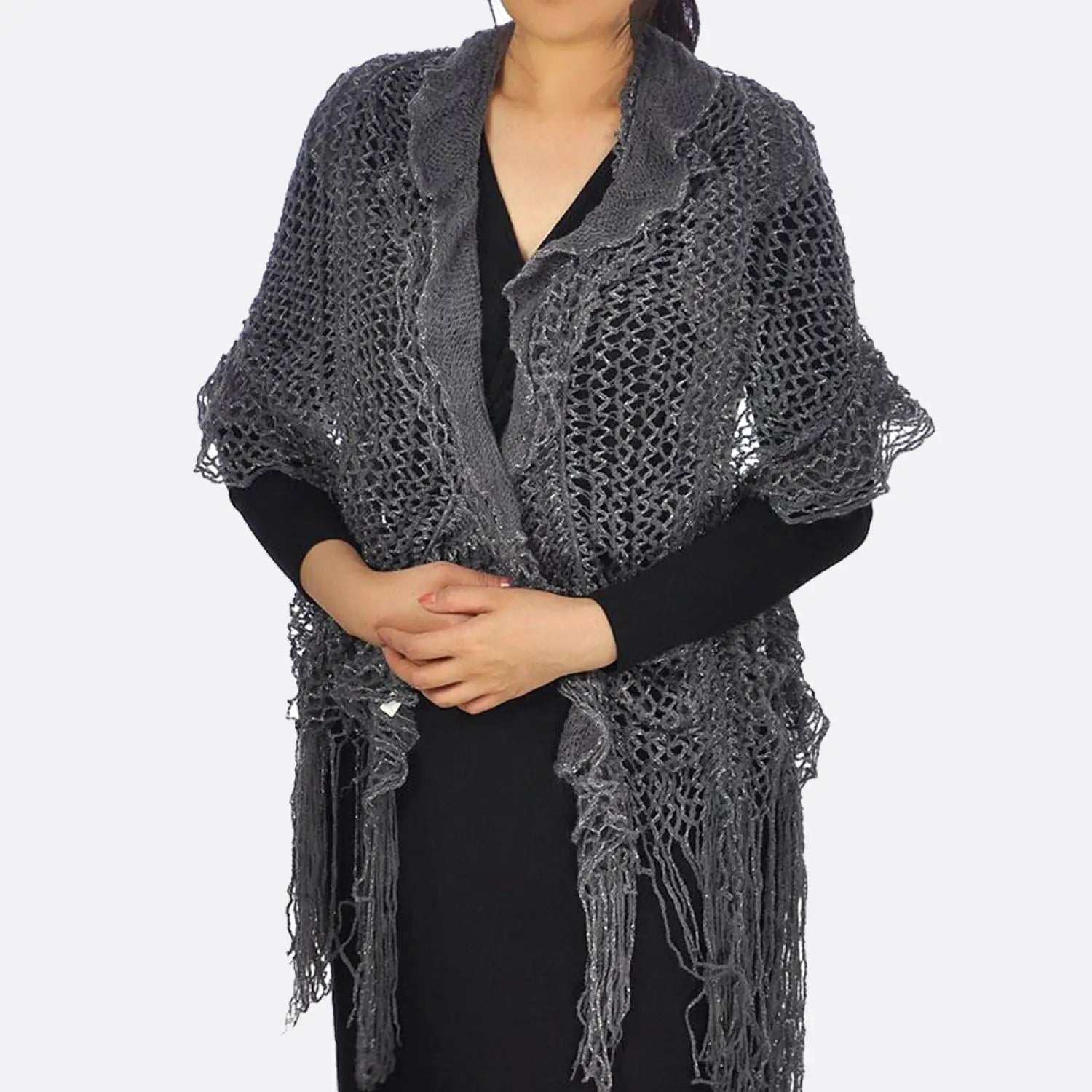 Woman wearing black shawl with fringes