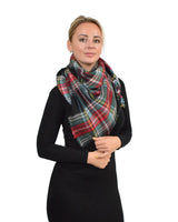 woman wearing oversized tartan check scarf.