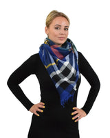 Woman wearing blue and yellow tartan check oversized poncho scarf