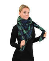 Woman in green and black plaid scarf on Oversized Tartan Check Winter Blanket Poncho