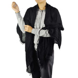 Oversized textured shawl on woman for autumn fashion.