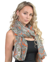 Woman wearing a paisley floral maxi scarf