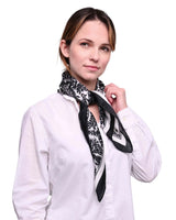 Paisley satin square scarf styled as a head wrap, worn by woman in white shirt and black scarf
