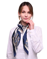 Woman wearing white shirt and blue scarf showcasing Paisley Satin Square Scarf Head Wrap.