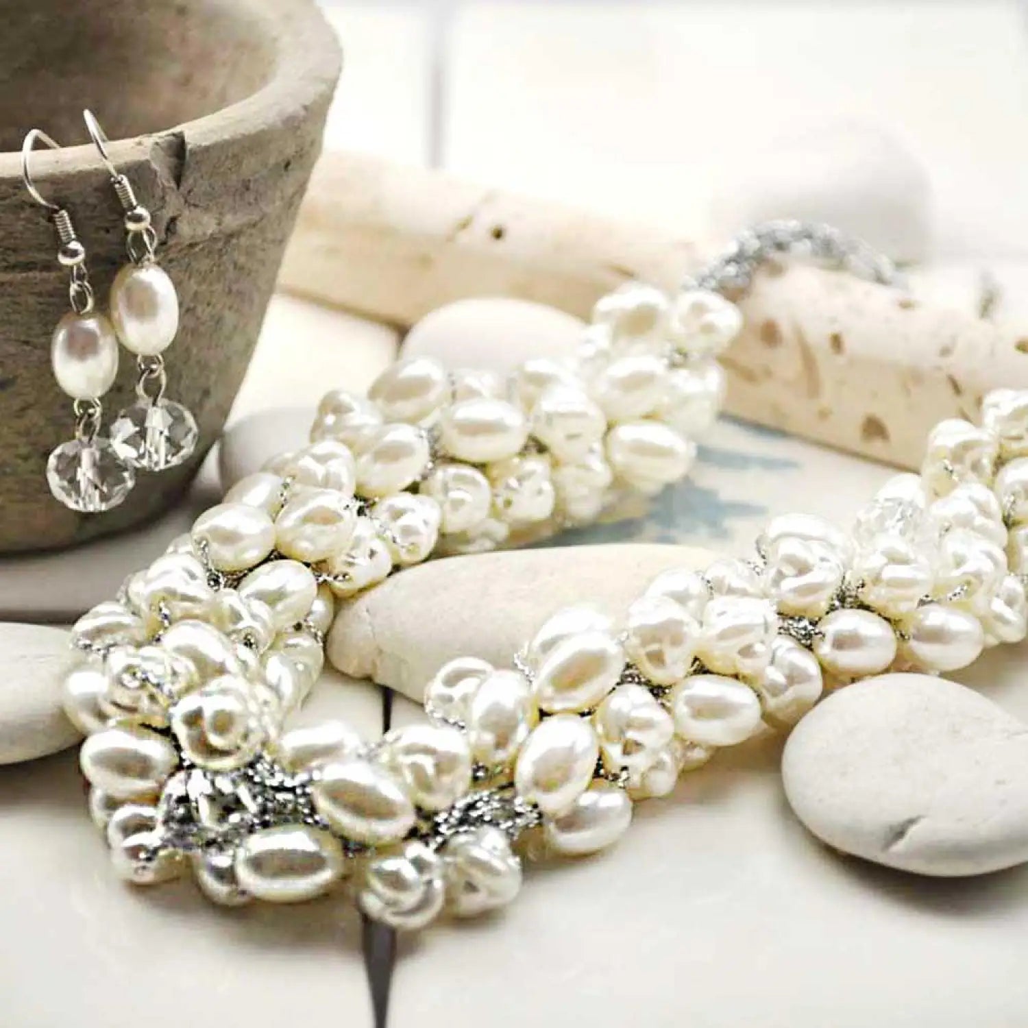 Pearl bead bracelet with crystals on white table