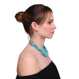 Woman wearing turquoise bead necklace from Pearl Bead Earring and Necklace Set.