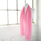 Light pink chiffon scarf with durable pearl attachments on white mannequin