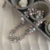 Pink Pearl Cluster Bib Necklace with silver beads displayed