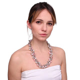 Woman in white dress with pink necklace wearing Pink Pearl Cluster Bib Necklace