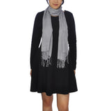 Woman wearing black dress and grey scarf, styled with Plain 100% Cotton Textured Woven Scarf.