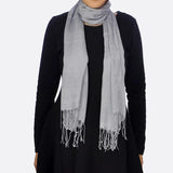 Woman wearing grey cotton textured woven scarf