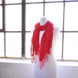 Red cotton textured woven scarf on mannequin.
