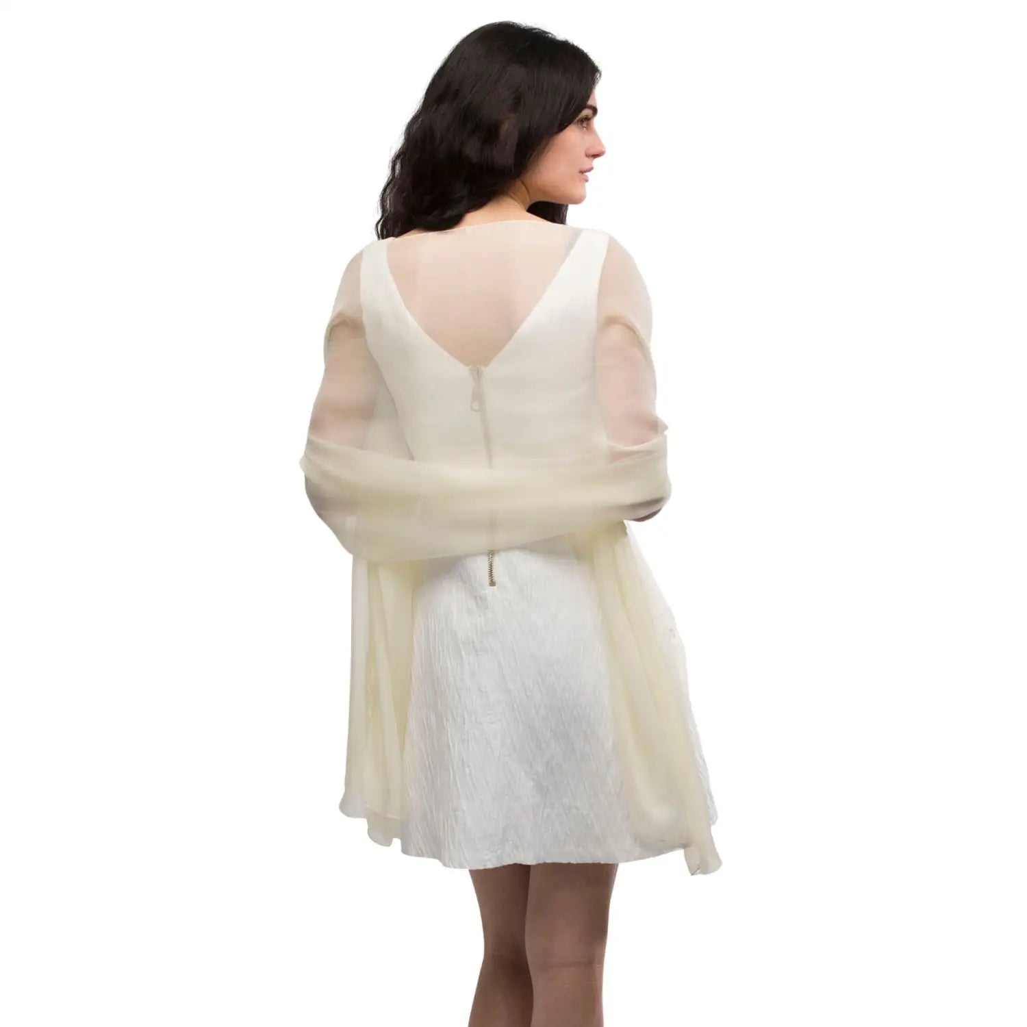 Woman in white dress and semi-opaque plain chiffon shawl.